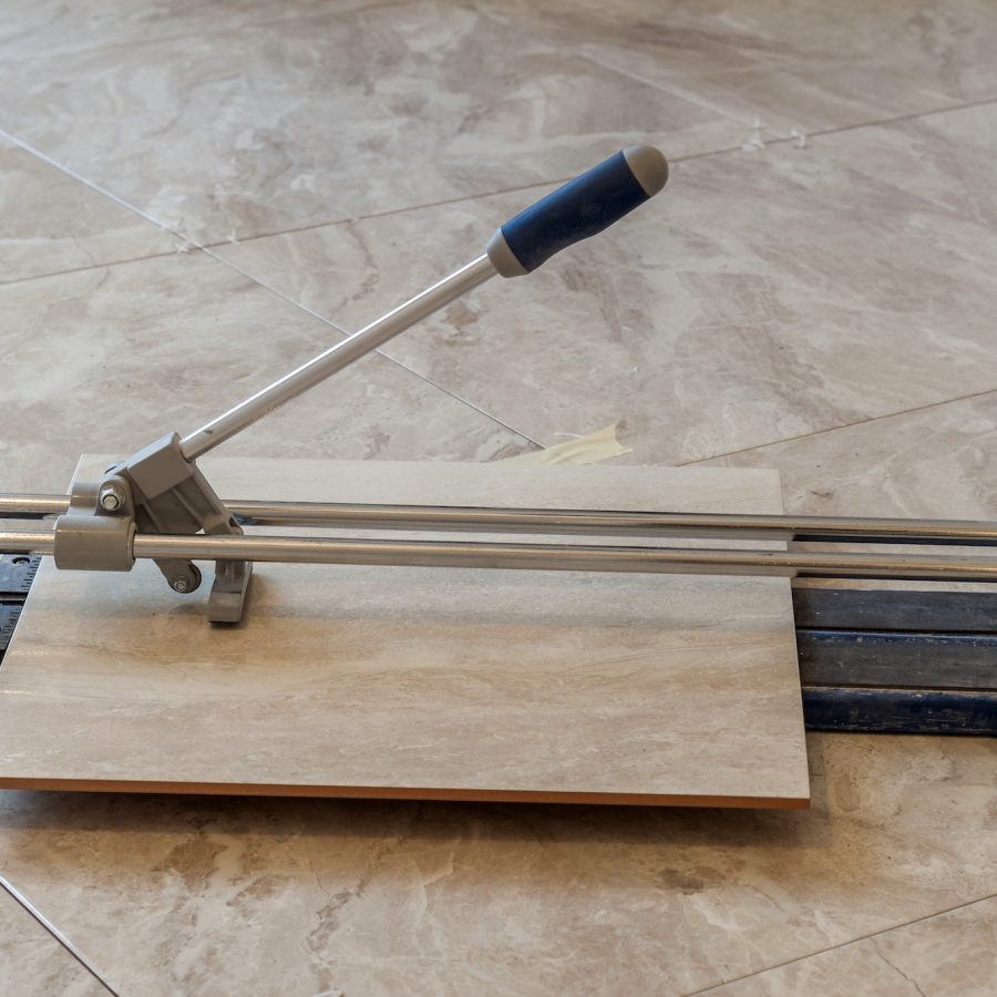 Ceramic tiles and tools for tiler. Floor tiles installation. Home improvement, renovation - ceramic