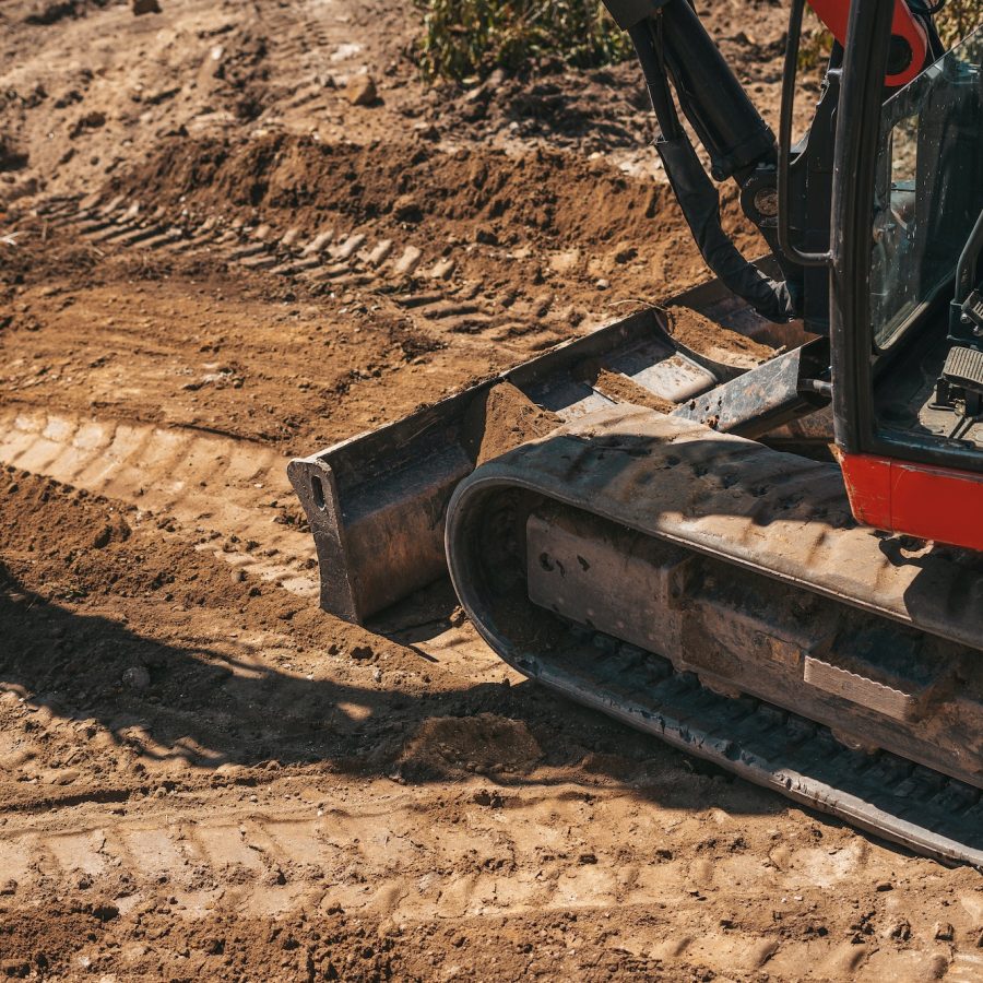 Close-up of an excavator wheels on a construction site